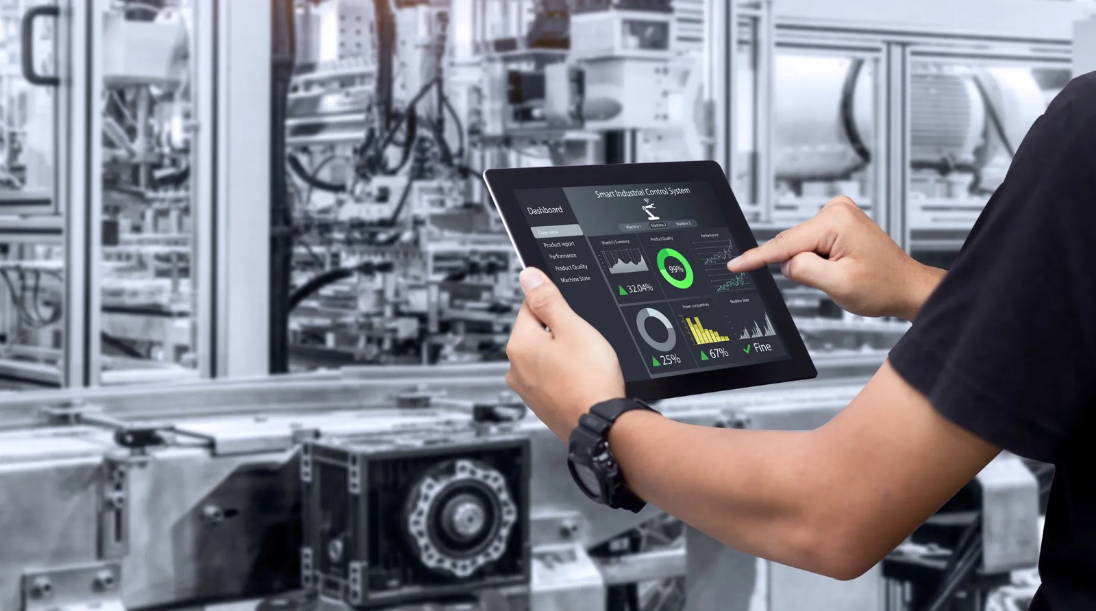 Industrial operator monitoring smart control systems on factory floor